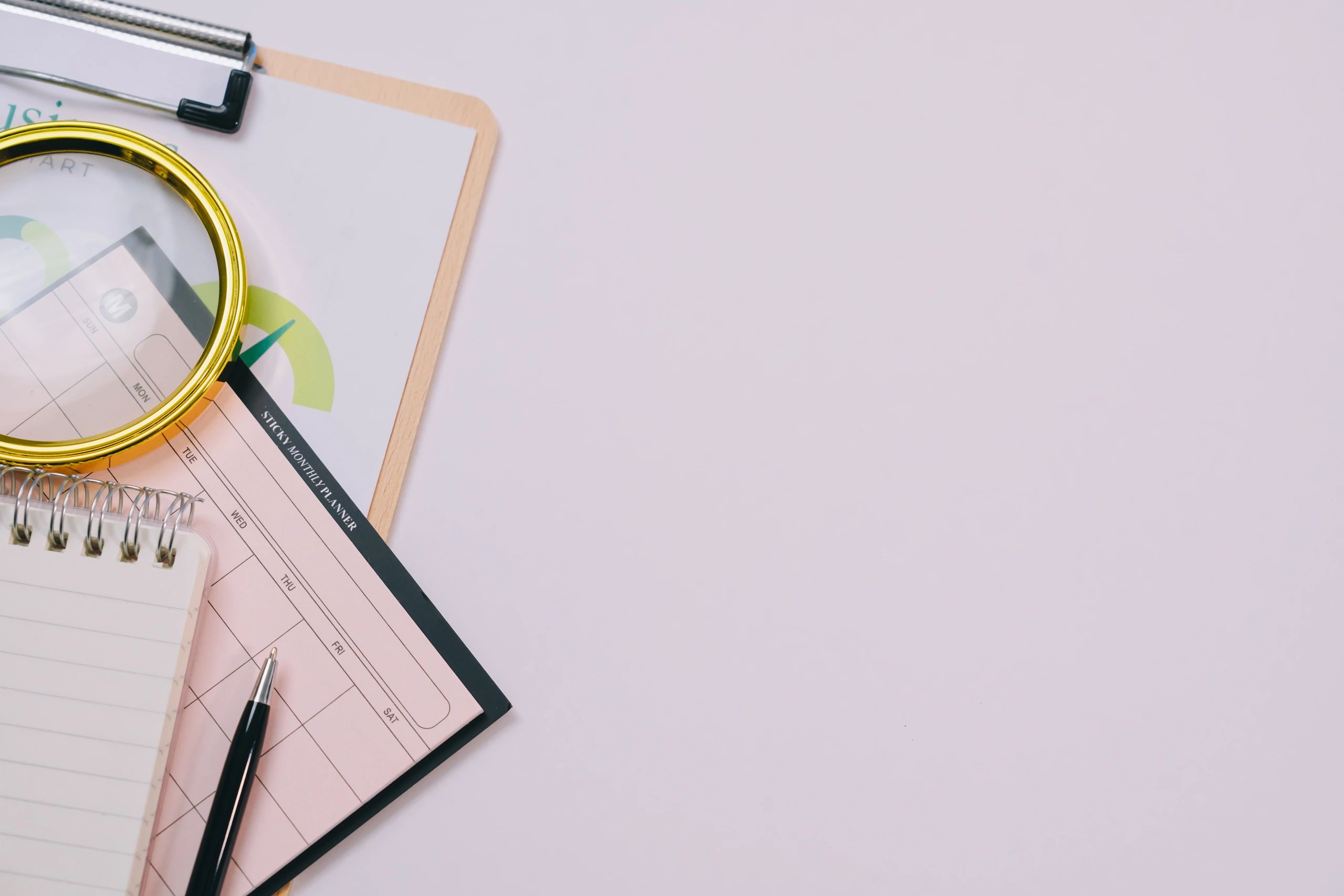 Clipboard and office planning tools on a desk